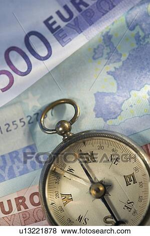 Euro notes and antique compass View Large Photo Image Stock Photo - Euro notes and antique compass. Fotosearch
