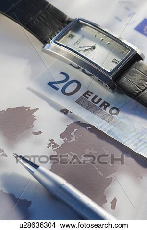 Euros and wristwatch View Large Photo Image Picture - Euros and wristwatch. Fotosearch