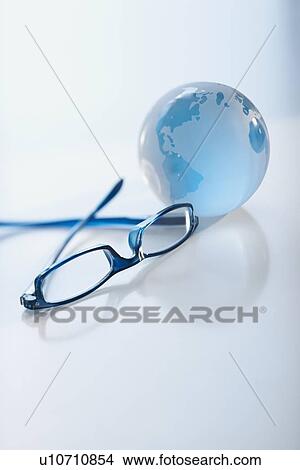 Eyeglasses and globe View Large Photo Image Picture - Eyeglasses and globe. Fotosearch