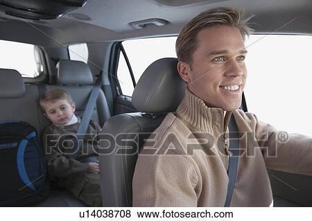 Stock Photo - Father driving son to school. Fotosearch