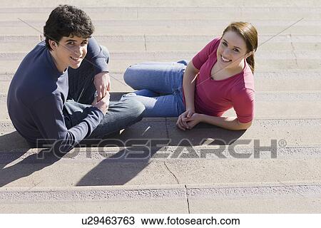 Friends sitting on steps View Large Photo Image Stock Image - Friends sitting on steps. Fotosearch