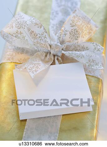 Gift with ribbon and card View Large Photo Image Stock Photograph - Gift with ribbon and card. Fotosearch