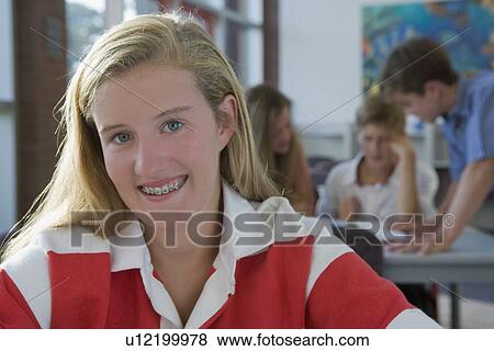 Stock Photo - Girl posing in library. Fotosearch