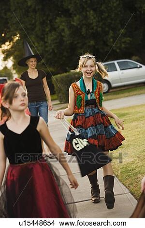 Girls trick or treating View Large Photo Image Picture - Girls trick or treating. Fotosearch