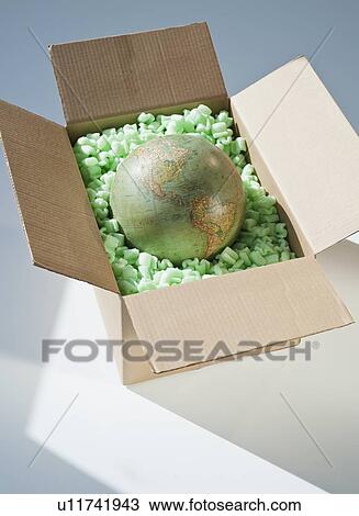 Stock Image - Globe in shipping box. Fotosearch