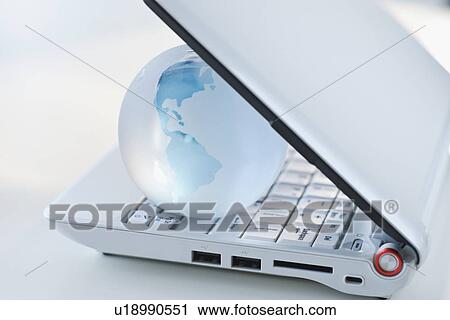 Globe inside laptop View Large Photo Image Stock Image - Globe inside laptop. Fotosearch