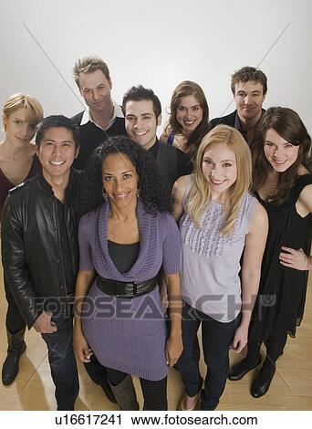 Group of friends posing together View Large Photo Image Stock Image - Group of friends posing together. Fotosearch
