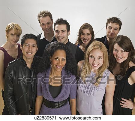 Group of friends posing together View Large Photo Image Stock Image - Group of friends posing together. Fotosearch