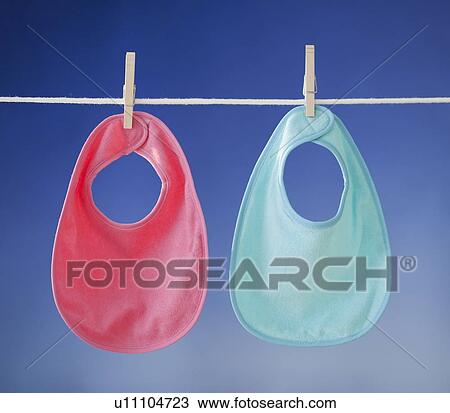 Stock Image - Hear cards drying on clothesline. Fotosearch