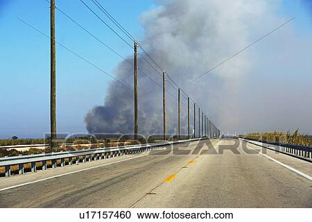 Highway and smoke in distance View Large Photo Image Stock Image - Highway and smoke in distance. Fotosearch