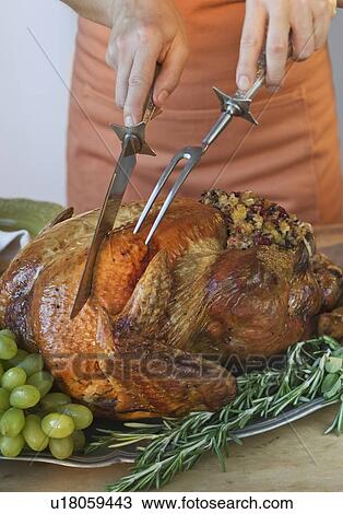 Man carving Thanksgiving turkey View Large Photo Image Stock Image - Man carving Thanksgiving turkey. Fotosearch