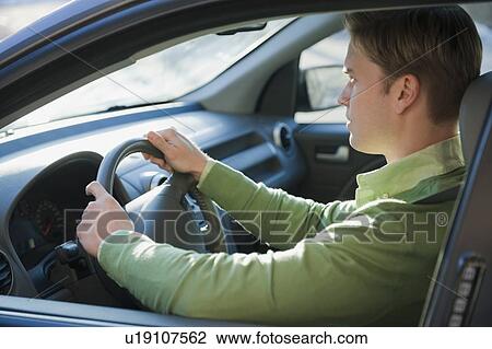 Stock Image - Man driving car. Fotosearch
