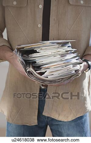 Man holding stack of mail View Large Photo Image Stock Photo - Man holding stack of mail. Fotosearch