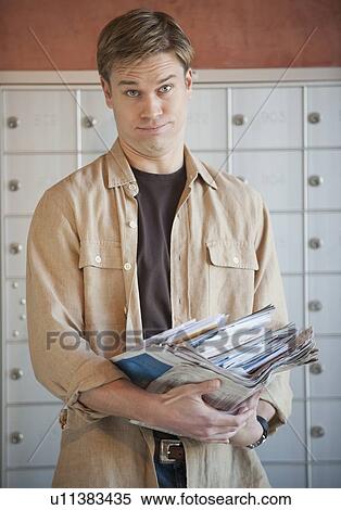 Man holding stack of mail View Large Photo Image Stock Photography - Man holding stack of mail. Fotosearch