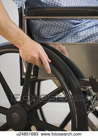 Stock Image - Man in wheelchair. Fotosearch