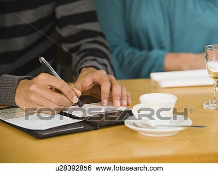 Man paying restaurant bill View Large Photo Image Stock Photograph - Man paying restaurant bill. Fotosearch
