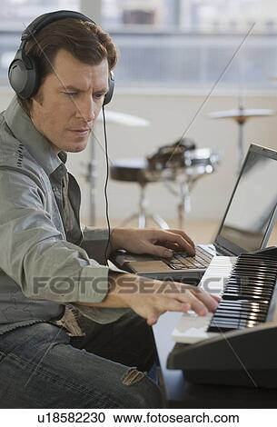 Man producing music View Large Photo Image Stock Image - Man producing music. Fotosearch