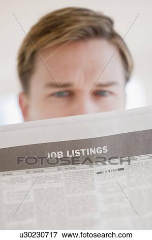 Man reading job listings View Large Photo Image Stock Photo - Man reading job listings. Fotosearch