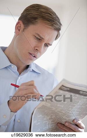 Man reading job listings View Large Photo Image Stock Photograph - Man reading job listings. Fotosearch