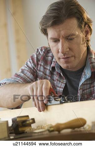 Picture - Man using woodworking tools. Fotosearch
