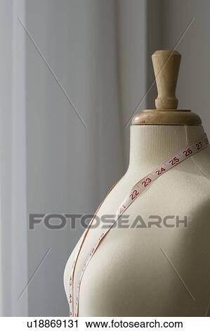 Measuring tape on dressmakers model View Large Photo Image Stock Image - Measuring tape on dressmakers model. Fotosearch