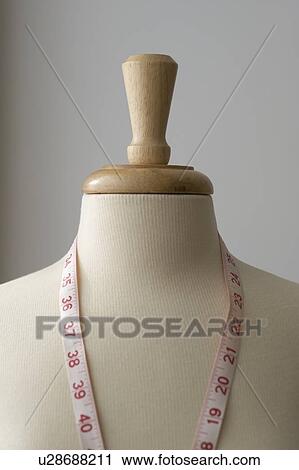 Measuring tape on dressmakers model View Large Photo Image Stock Image - Measuring tape on dressmakers model. Fotosearch