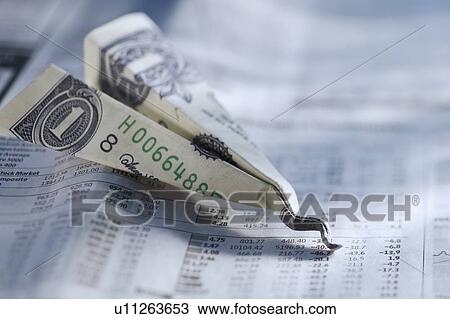 Stock Image - Money paper airplane. Fotosearch