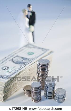 Money with bride and groom figurine View Large Photo Image Stock Photo - Money with bride and groom figurine. Fotosearch