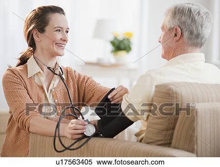 Nurse taking senior man’s blood pressure View Large Photo Image Stock Photography - Nurse taking senior man’s blood pressure. Fotosearch