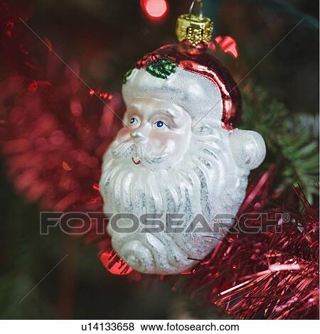 Ornament hanging on Christmas tree View Large Photo Image Stock Photo - Ornament hanging on Christmas tree. Fotosearch