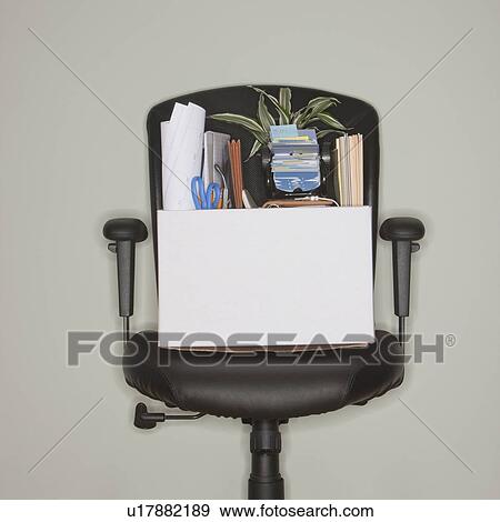 Packed box on office chair View Large Photo Image Stock Photo - Packed box on office chair. Fotosearch