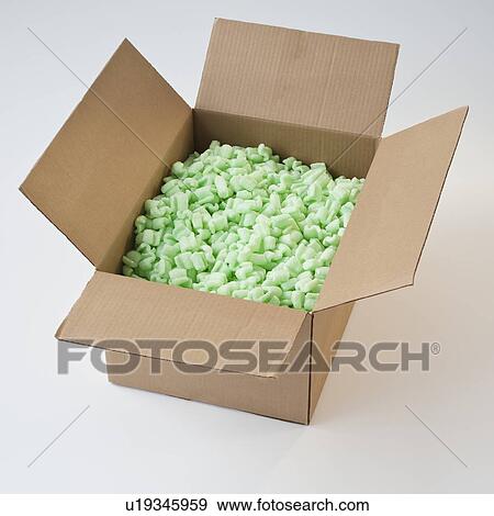 Packing peanuts in cardboard box View Large Photo Image Stock Photo - Packing peanuts in cardboard box. Fotosearch