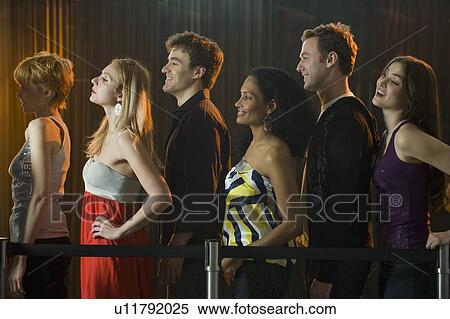 Stock Photography - People waiting in line at nightclub. Fotosearch
