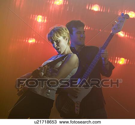 Stock Image - Performers playing electric guitars. Fotosearch