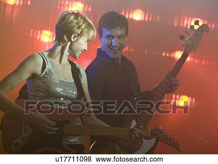 Performers playing electric guitars View Large Photo Image Stock Photo - Performers playing electric guitars. Fotosearch