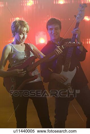 Performers playing electric guitars View Large Photo Image Stock Photography - Performers playing electric guitars. Fotosearch