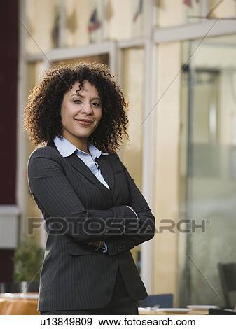 Stock Photo - Portrait of confident businesswoman. Fotosearch