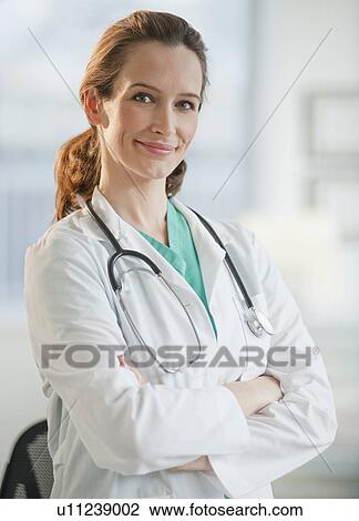 Stock Image - Portrait of female doctor. Fotosearch