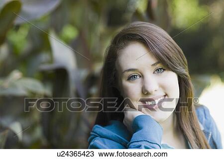 Portrait of teenage girl in park View Large Photo Image Stock Image - Portrait of teenage girl in park. Fotosearch