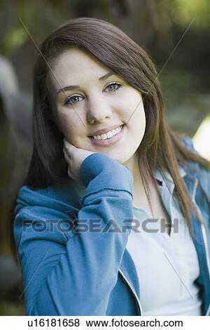 Portrait of teenage girl in park View Large Photo Image Stock Photo - Portrait of teenage girl in park. Fotosearch