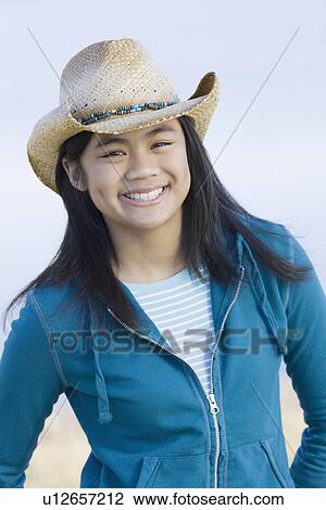 Portrait of teenage girl wearing cowboy hat View Large Photo Image Stock Image - Portrait of teenage girl wearing cowboy hat. Fotosearch