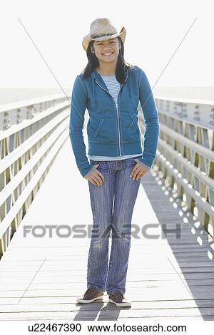 Portrait of teenage girl wearing cowboy hat View Large Photo Image Stock Image - Portrait of teenage girl wearing cowboy hat. Fotosearch