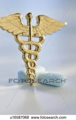 Stock Photo - Prescription medicine and caduceus. Fotosearch