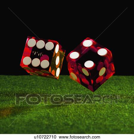 Stock Image - Rolling dice. Fotosearch