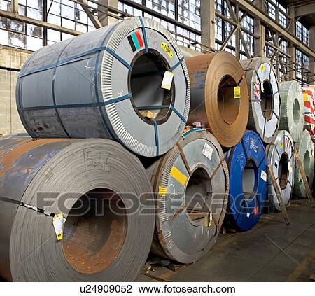 Stock Image - Rolls of steel in warehouse. Fotosearch