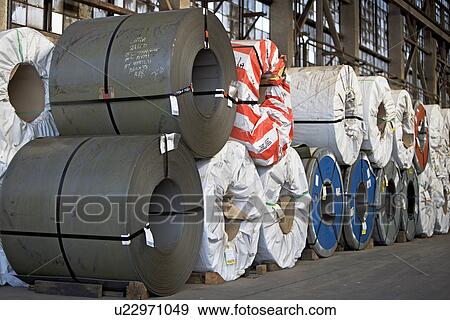Stock Photo - Rolls of steel in warehouse. Fotosearch