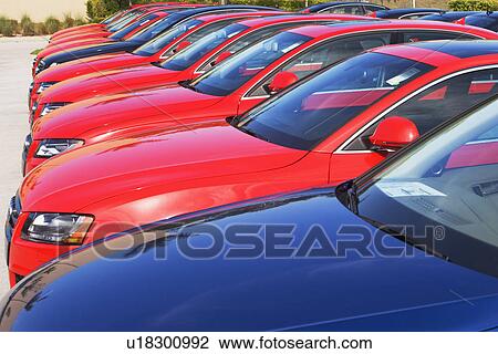 Stock Image - Row of cars in car lot. Fotosearch