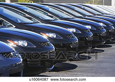 Row of cars in car lot View Large Photo Image Stock Photo - Row of cars in car lot. Fotosearch