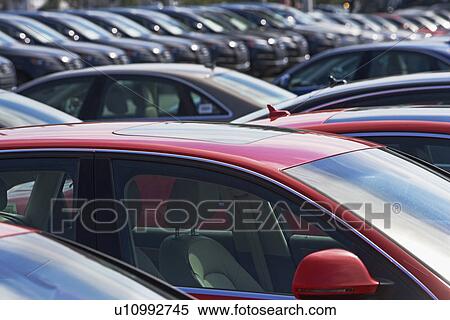 Stock Photography - Row of cars in car lot. Fotosearch