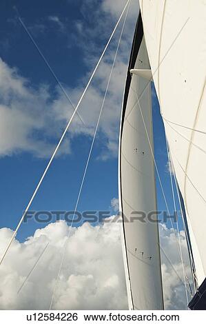 Stock Photograph - Sailboat and blue sky. Fotosearch